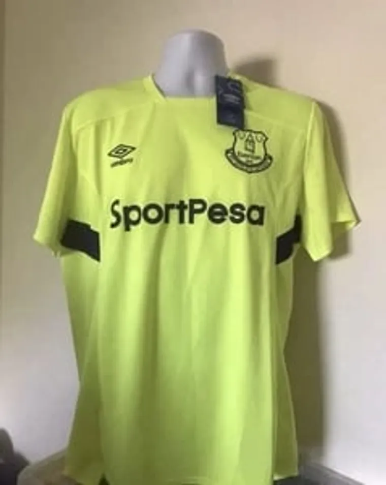 Lime green Everton football shirt on a mannequin