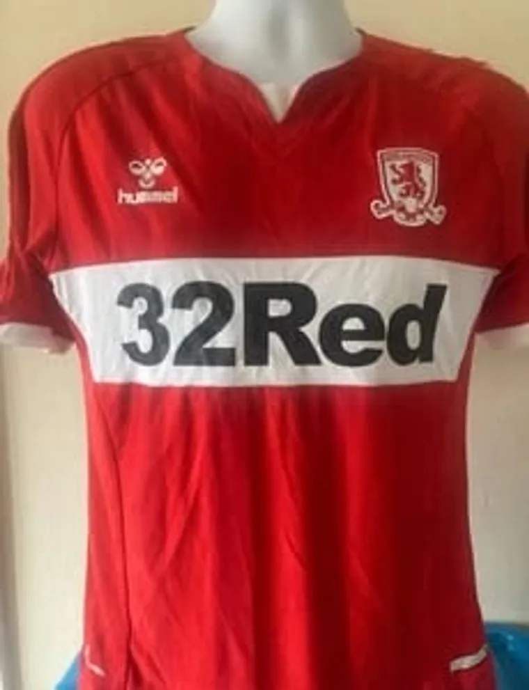 Red Middlesbrough football shirt with 32Red sponsor on a mannequin